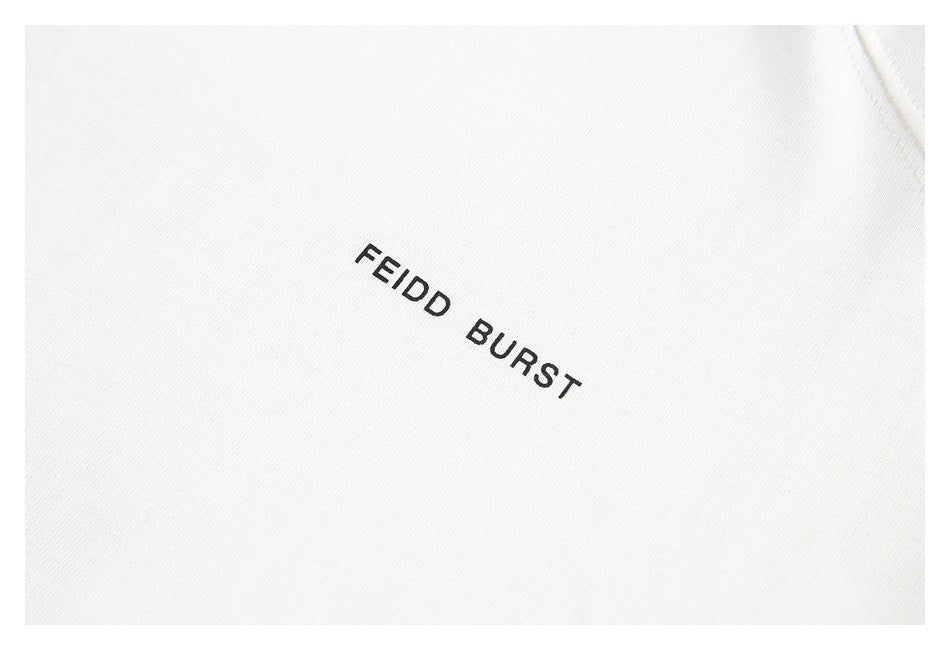Close-up of a white shirt with small black “FEIDD BURST” text printed on the chest.