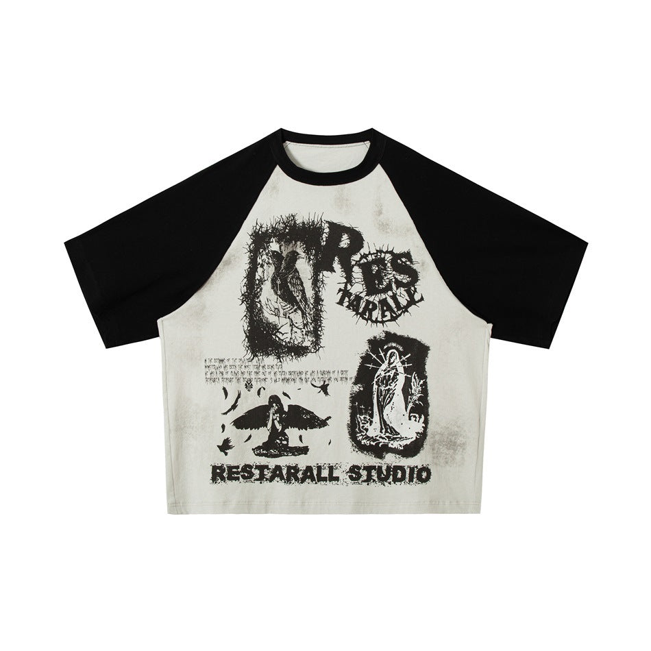 Off-white raglan T-shirt with black sleeves and collar and a black distressed graphic print on the front