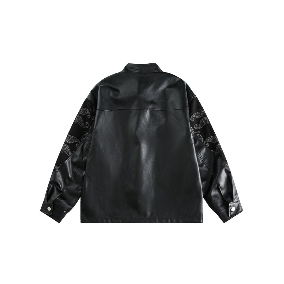 Flat product photo of the black jacket from the back, showing paisley-patterned upper sleeves and buttoned cuffs.