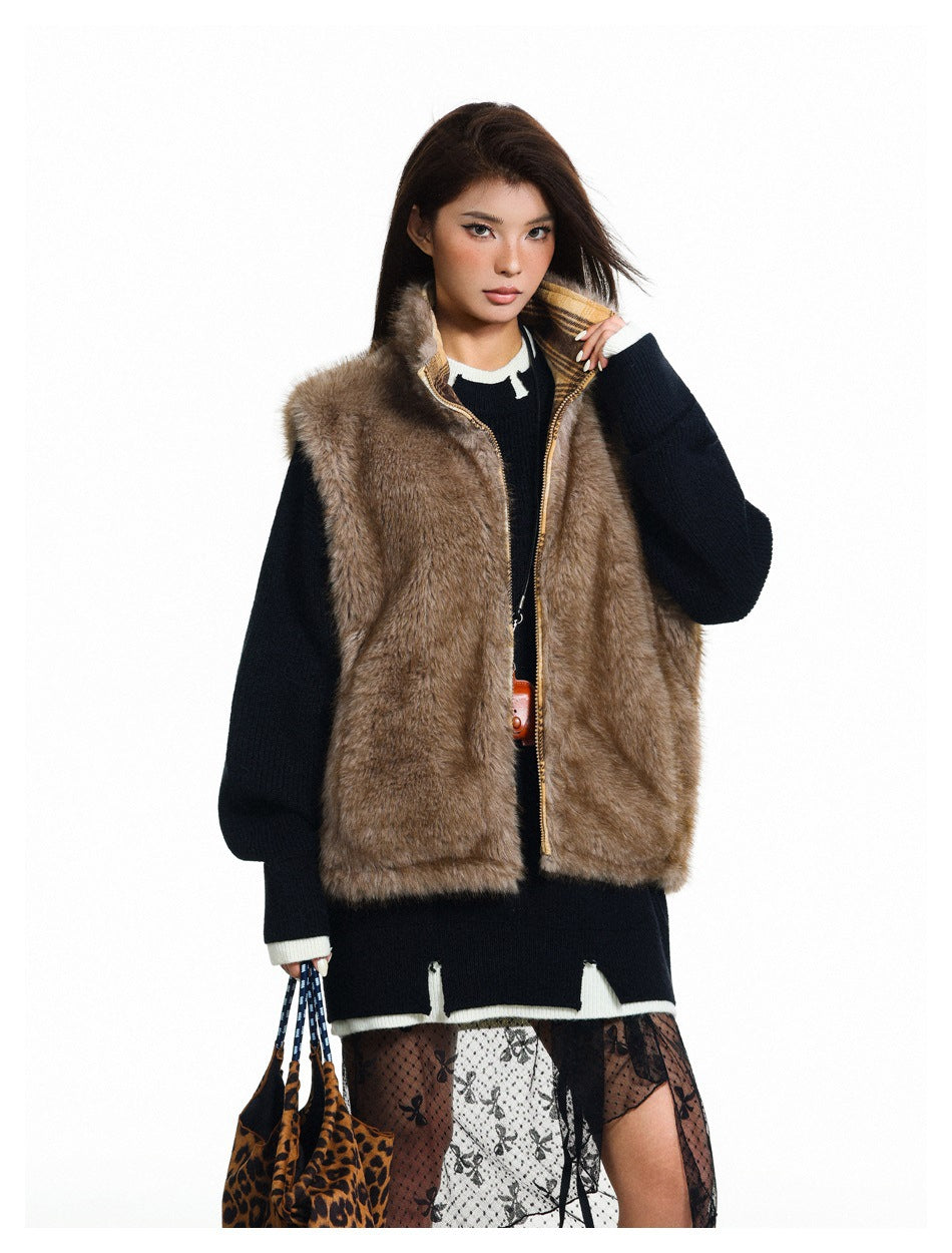 Model wearing an open brown fur-textured vest with a plaid collar over a dark sweater.