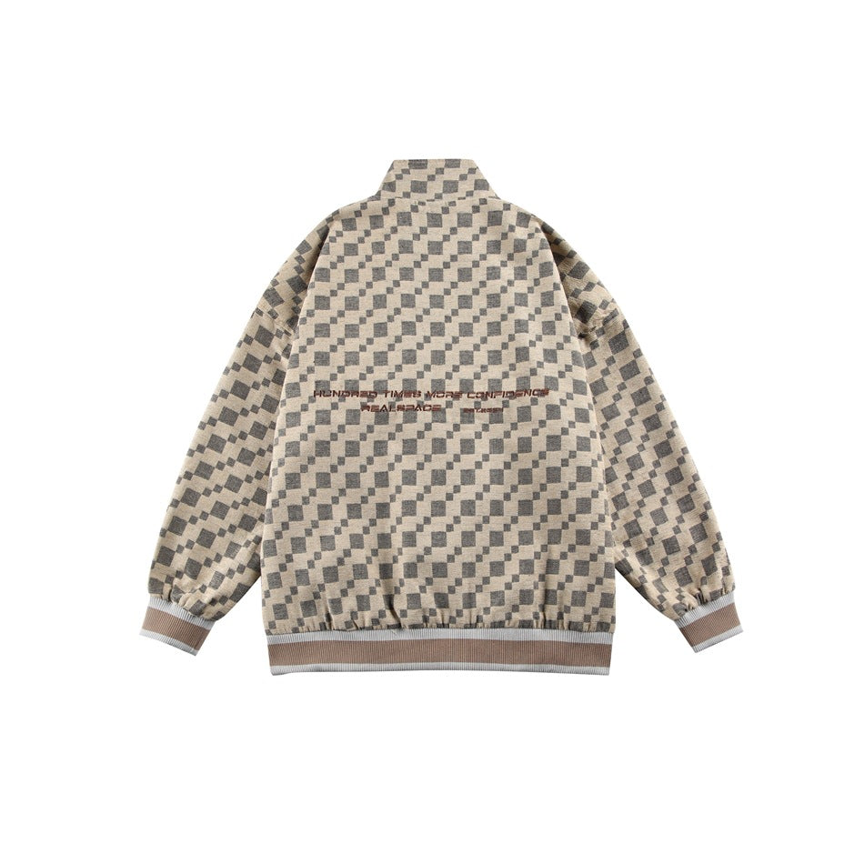 Flat-lay back view of a beige and charcoal checker-pattern jacket with striped ribbed cuffs and hem and text across the back.