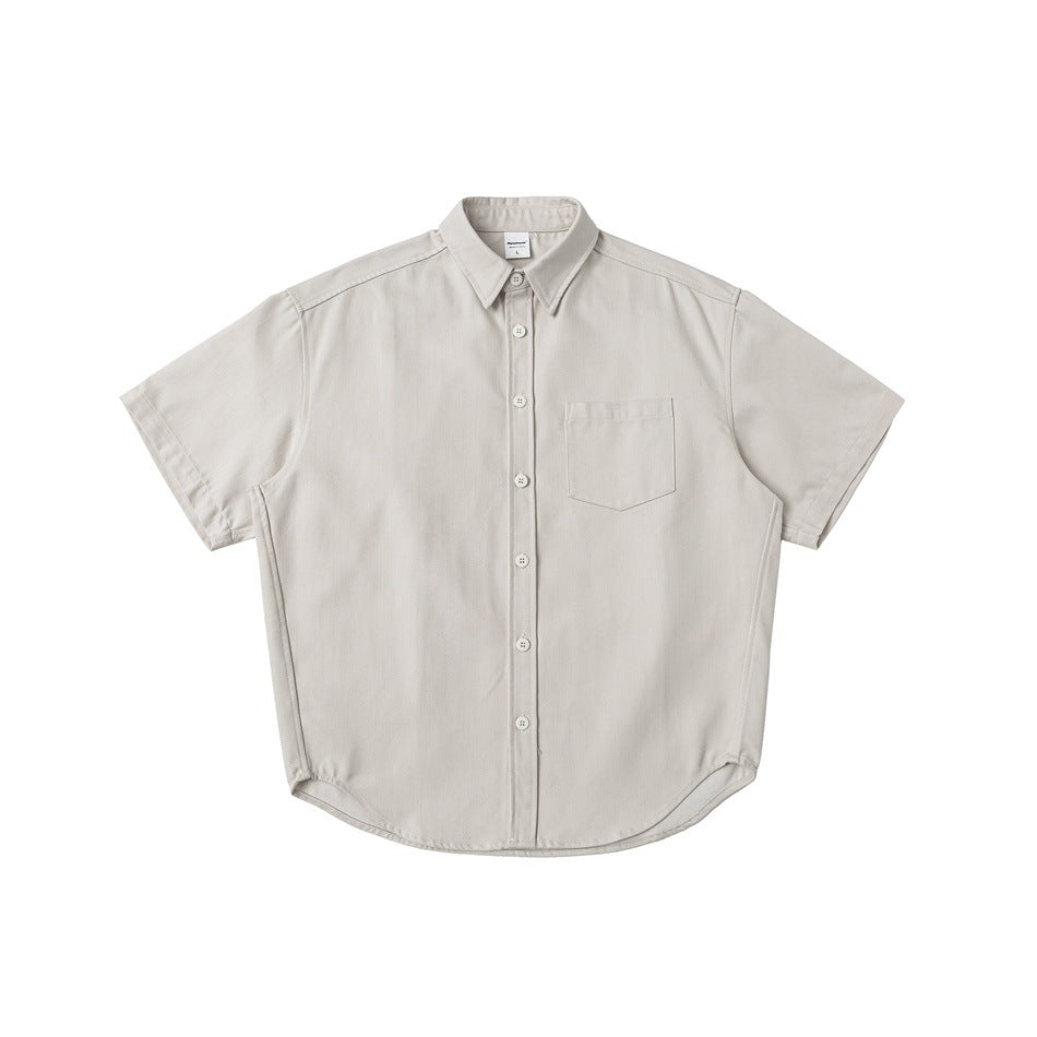 Off-white short-sleeve button-up shirt with chest pocket and curved hem, flat lay front view