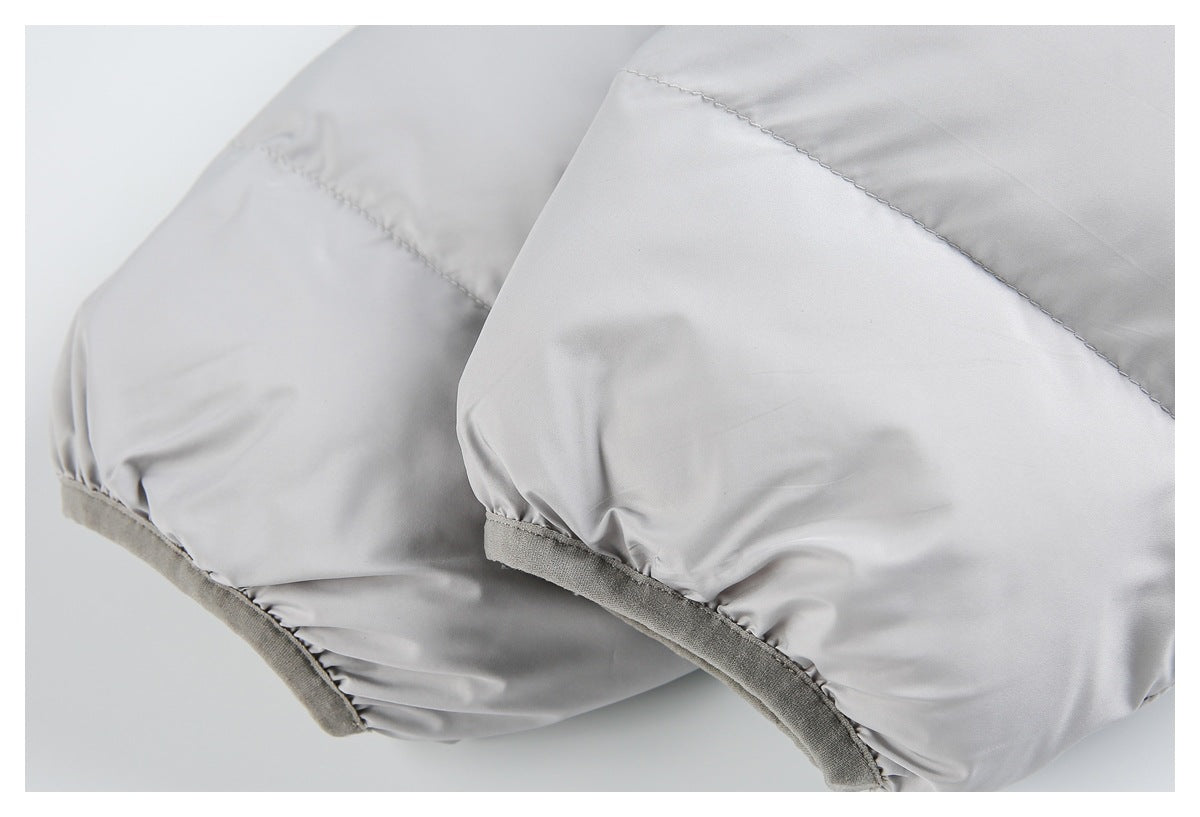 Close-up of a light gray jacket sleeve with a gathered edge and gray binding.