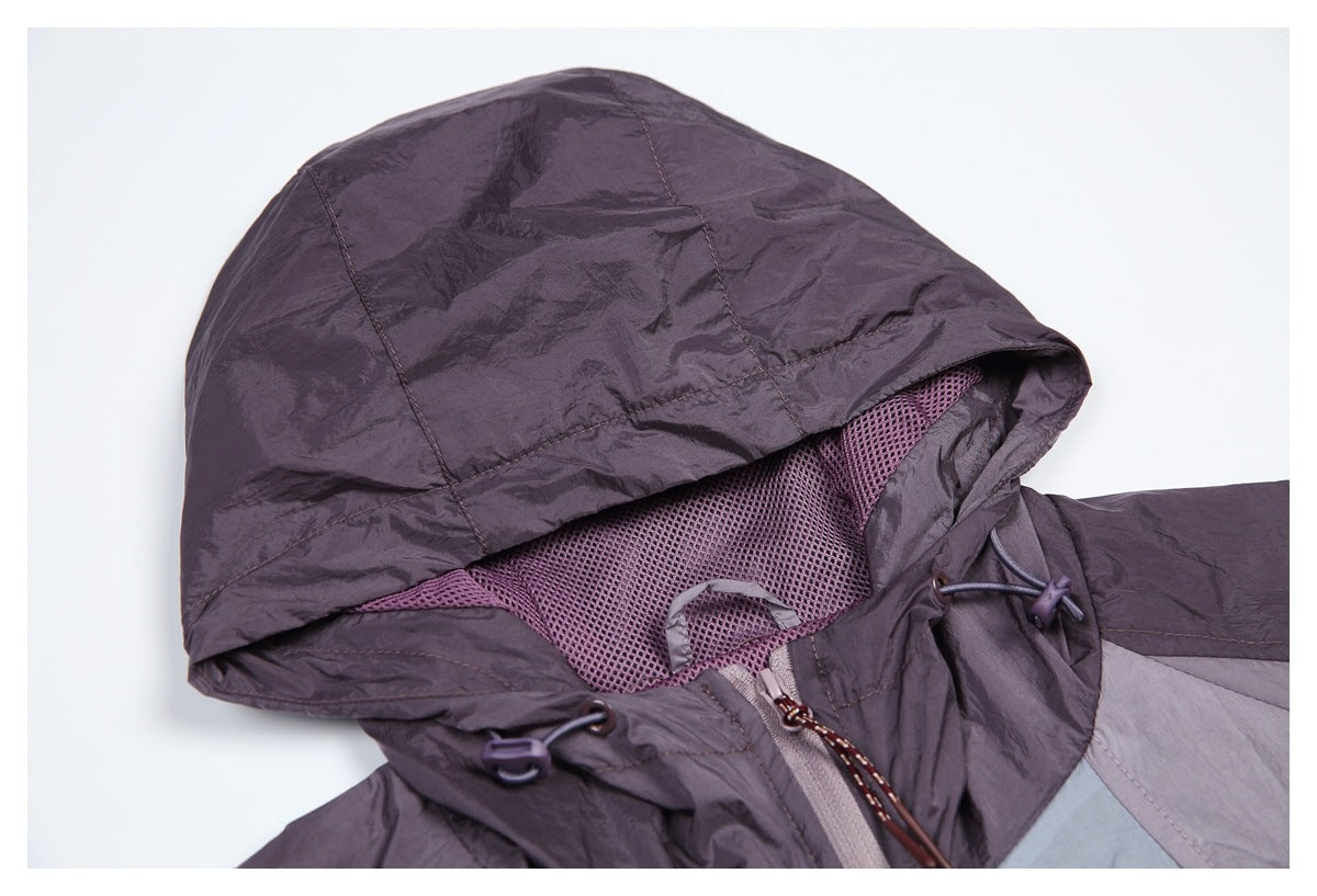 Close-up of the hood's mesh lining, adjustment toggles, and upper front zipper.