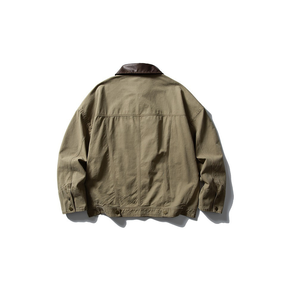 Back view of a khaki jacket with a dark brown collar, panel seams, and snap-tab cuffs and hem.