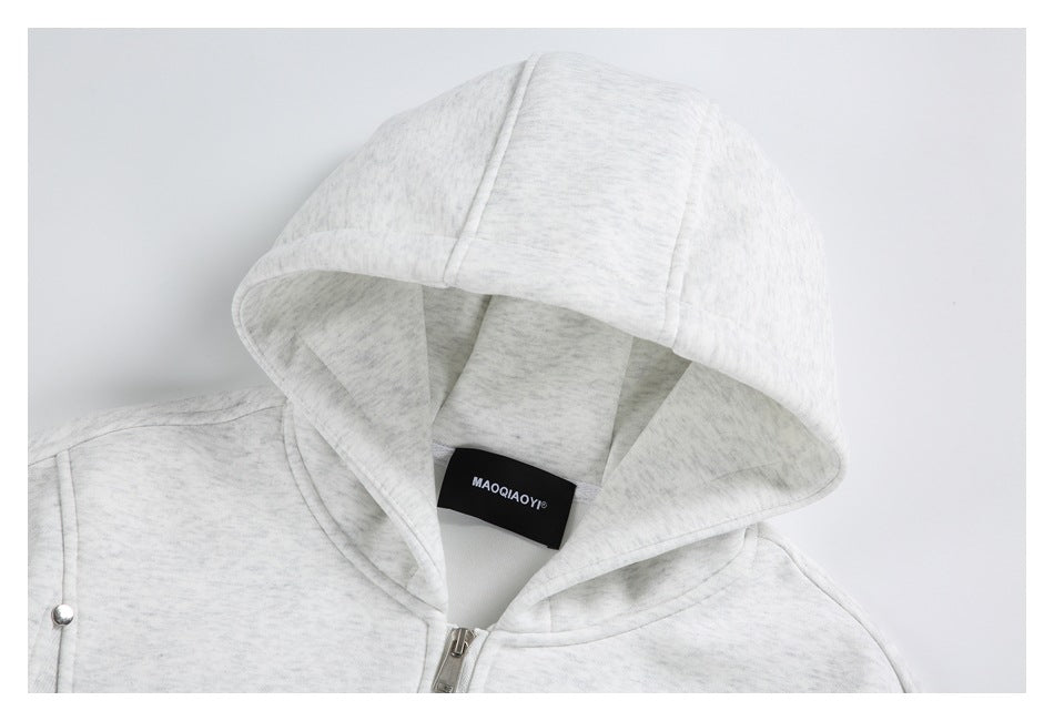 Close-up of the light gray heather hoodie’s hood and neckline, with its zipper and sewn-in neck label visible.