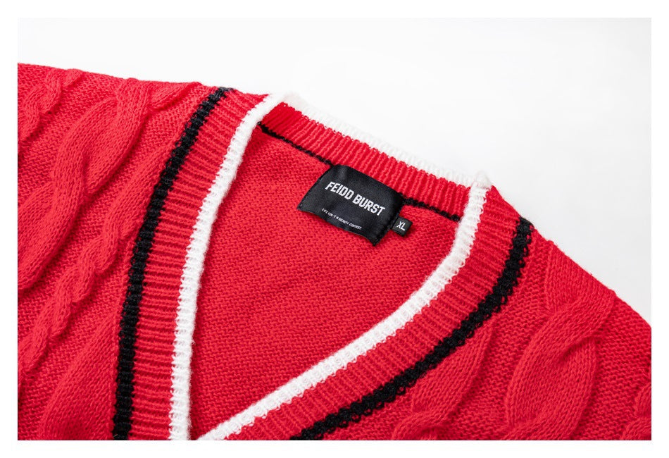 Close-up of the red cardigan's V-neck trim, cable-knit texture, and sewn FEIDO BURST label.