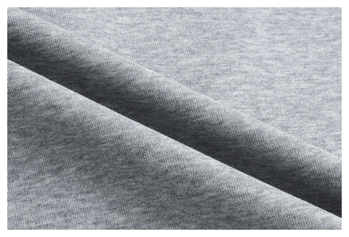 Macro view of the heather gray knit fabric, folded to show its texture.
