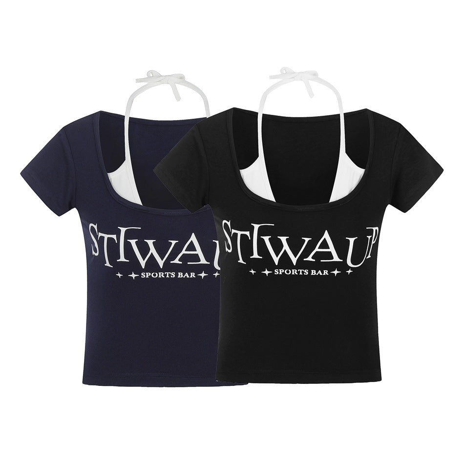 Navy and black cropped scoop-neck tees shown together, each with white halter straps and a white chest graphic.