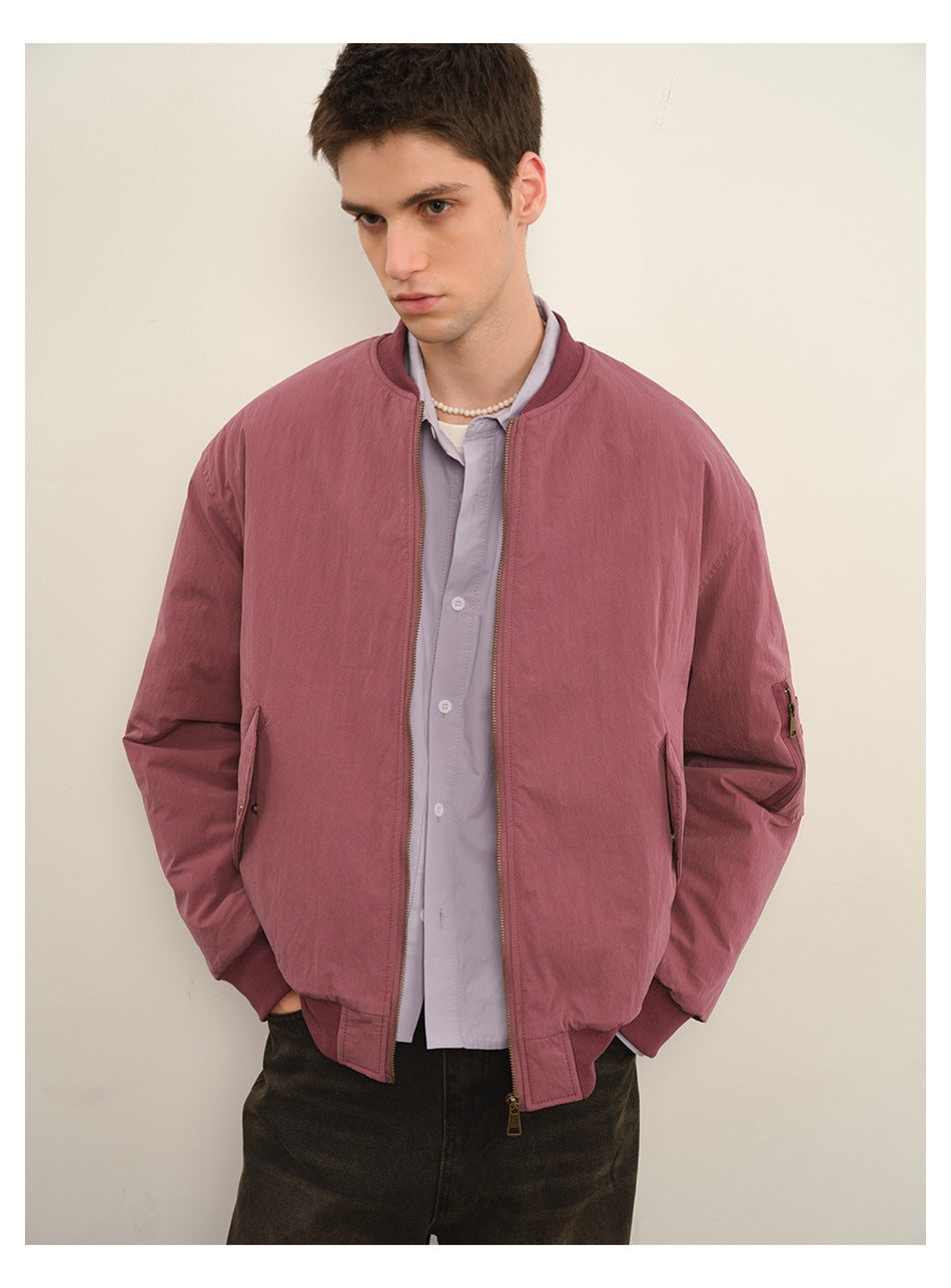 Front view of a model wearing an open dusty rose bomber jacket with ribbed collar and cuffs.