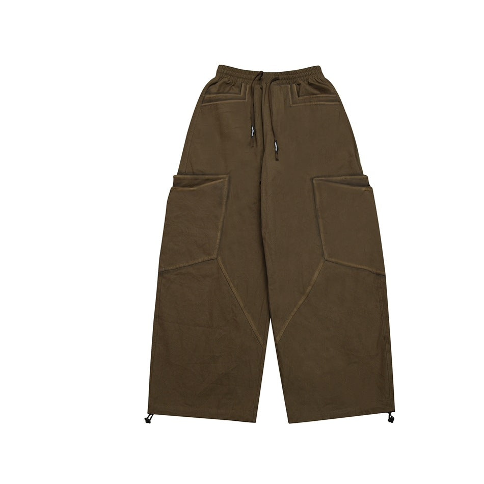Coffee brown wide-leg cargo pants with drawstring waist, large side pockets and toggle hems, flat front view