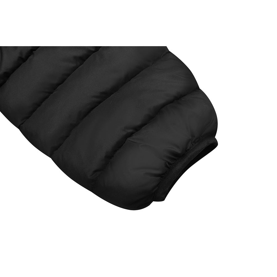 Close-up of a black quilted jacket sleeve ending in a narrow elastic cuff.