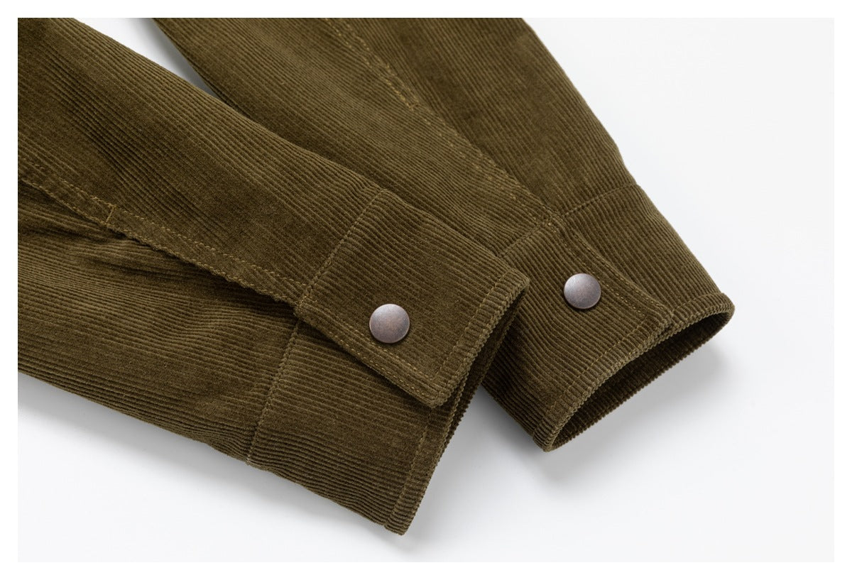 Close-up of olive-brown corduroy sleeves with wide snap-button cuffs.