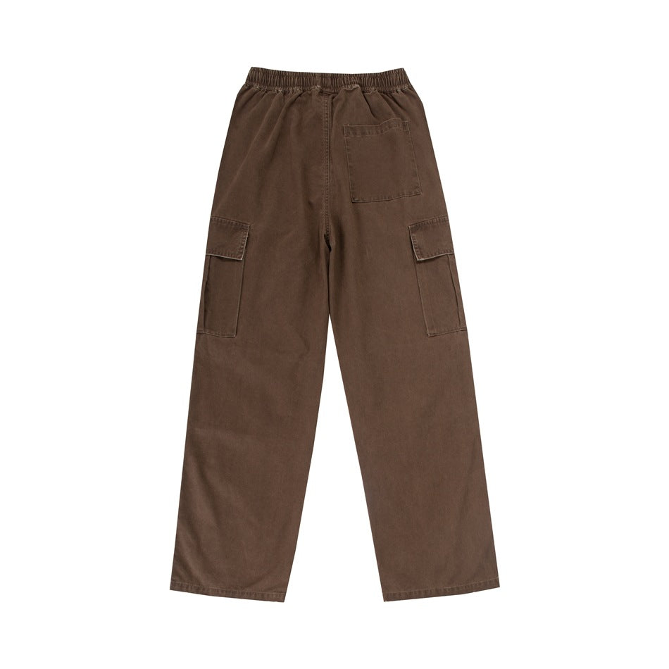 Rear view of brown wide-leg cargo pants with an elastic waist, one back patch pocket and flap cargo pockets.