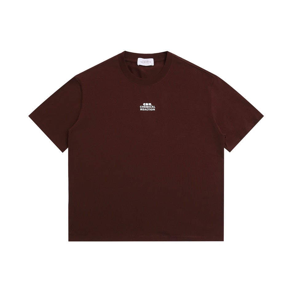 Burgundy short-sleeve crew-neck t-shirt flat lay with a small white chest print and white neck label