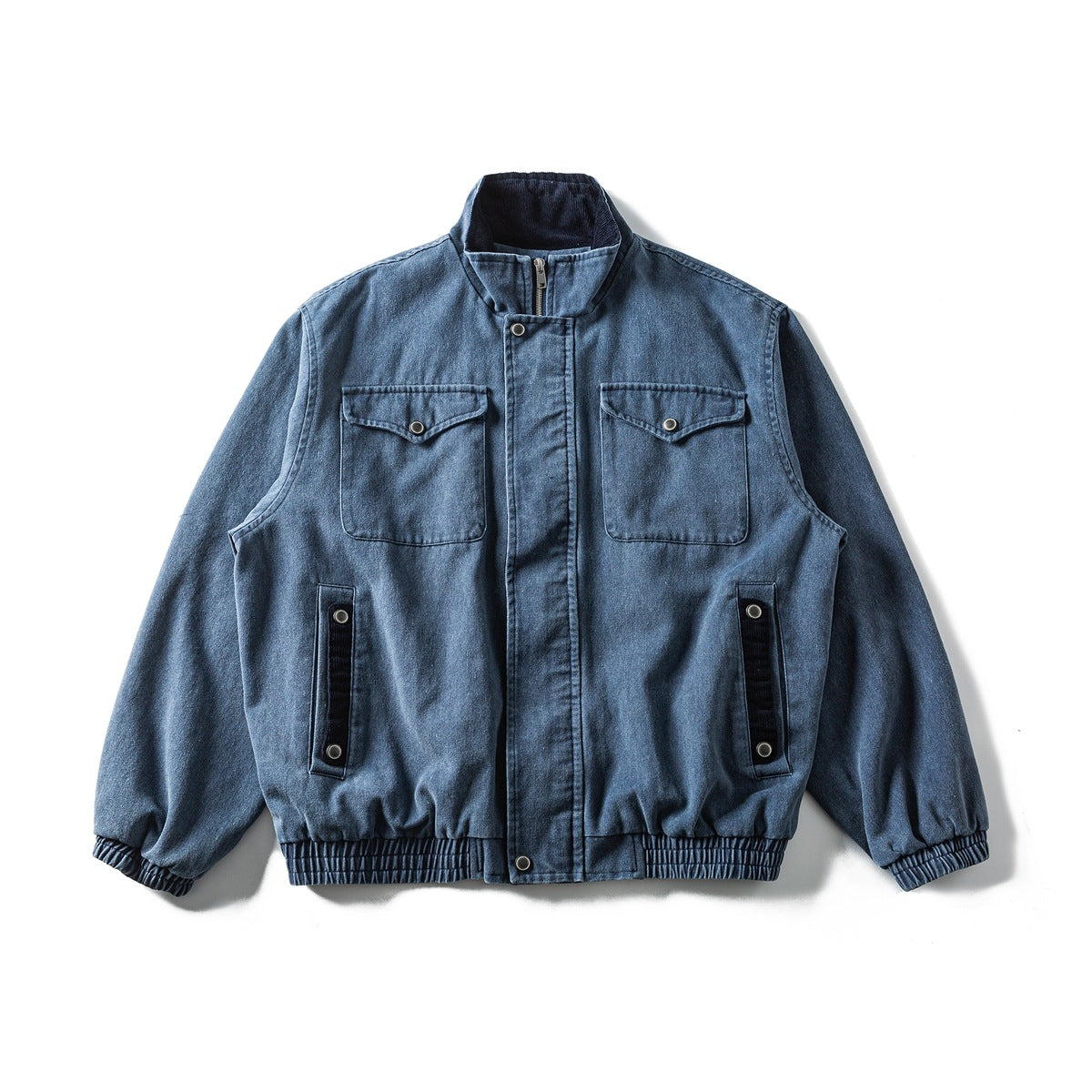 Washed blue stand-collar jacket flat lay with snap-flap chest pockets, side pocket trim and elastic ribbed cuffs