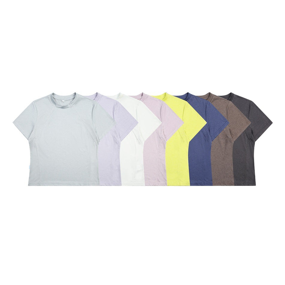 Front view of short-sleeve crew-neck shirts arranged in pale gray, lavender, white, pink, yellow, blue, brown, and charcoal.