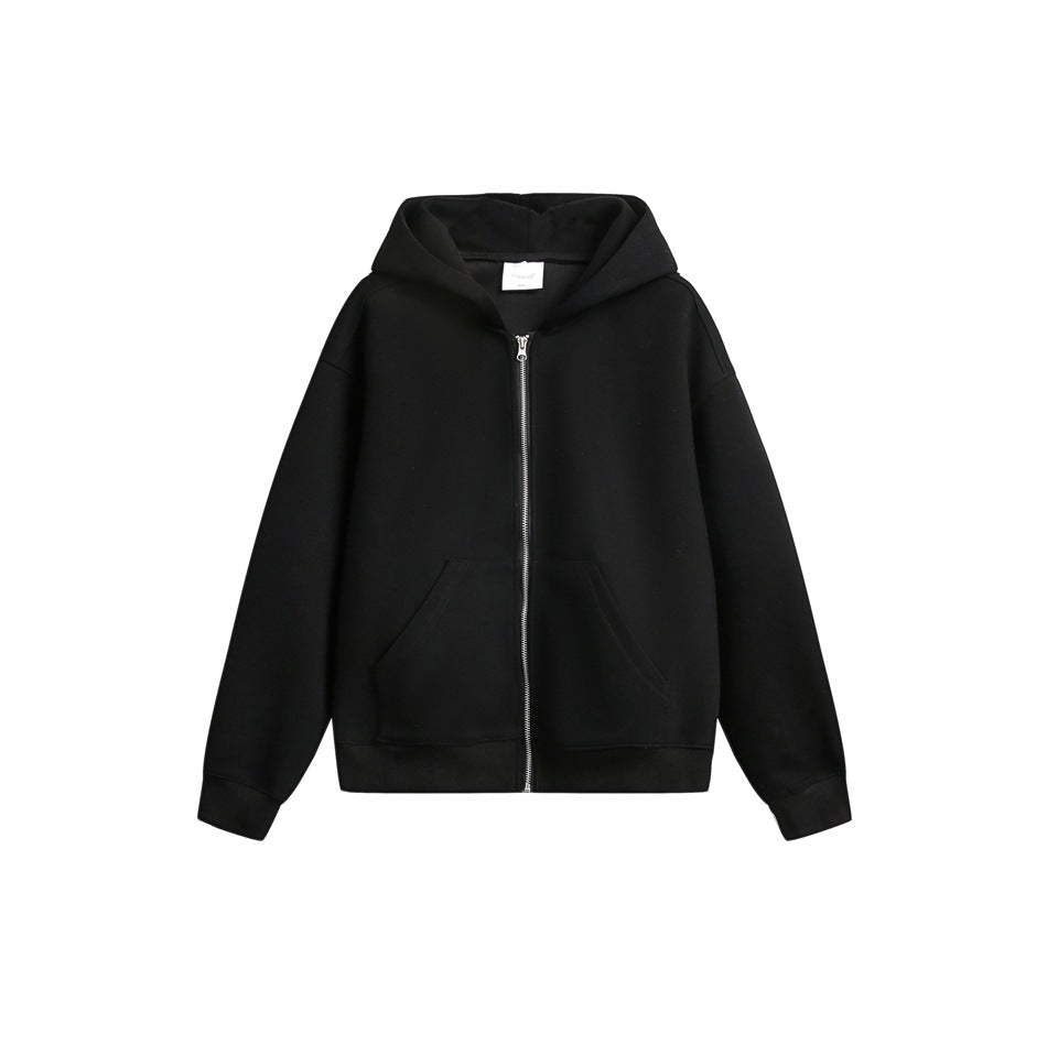 Black zip-up hoodie flat lay with silver zipper, front pockets and ribbed cuffs and hem