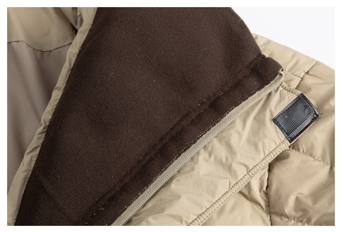 Close-up showing the dark brown inner lining and fastening tab of a beige padded jacket.