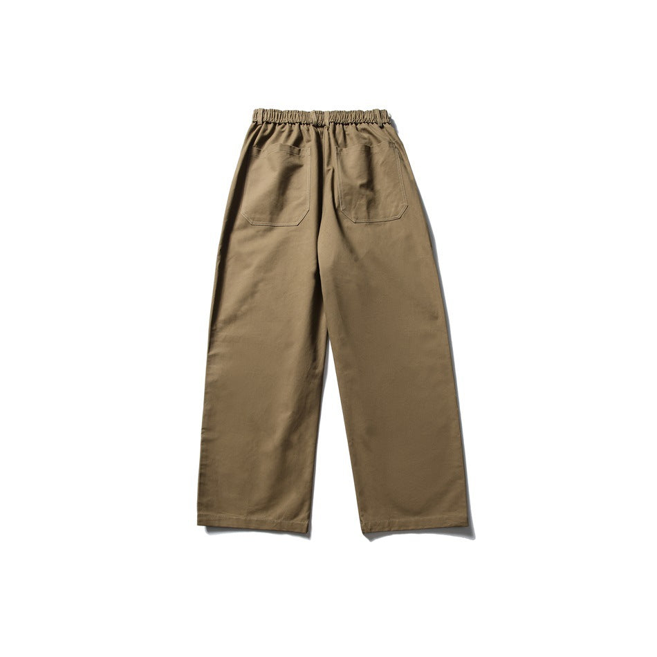 Back view of olive-brown wide-leg trousers with an elastic waistband and two patch pockets.