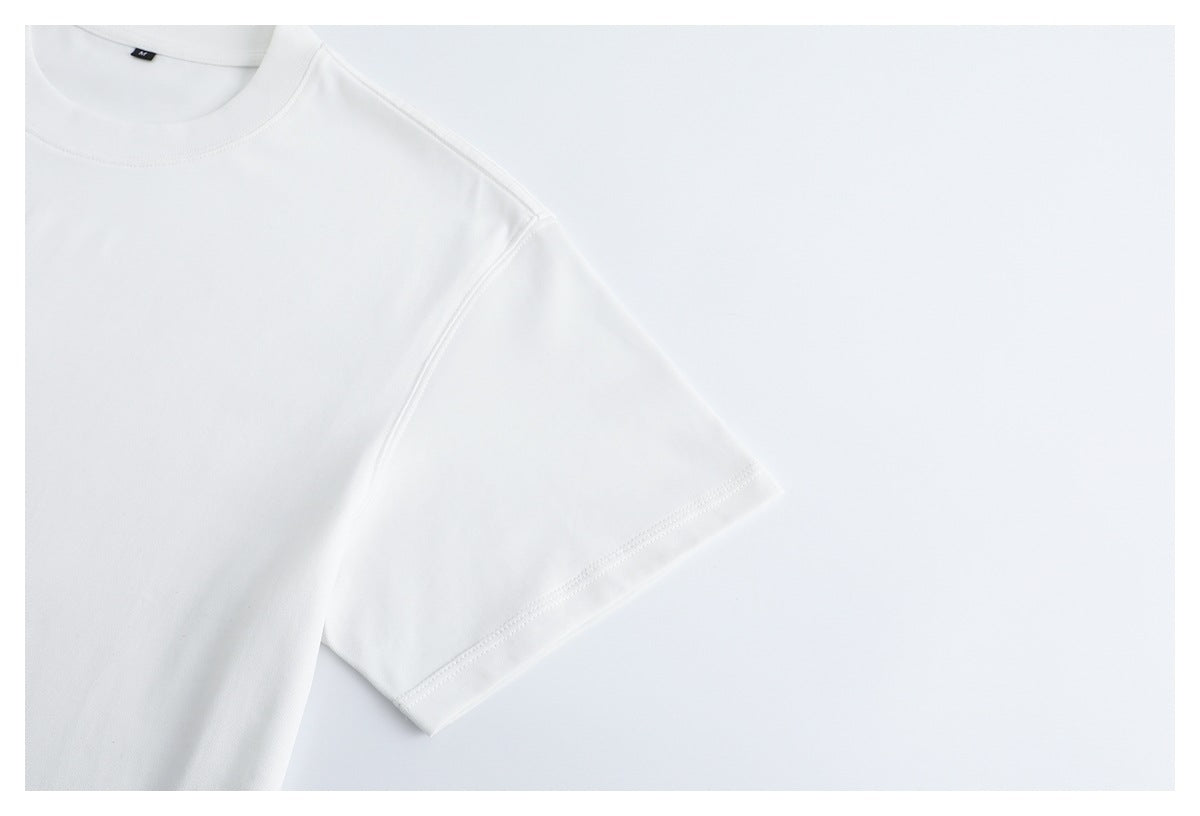 Close-up of the white T-shirt's short sleeve and stitched sleeve hem.