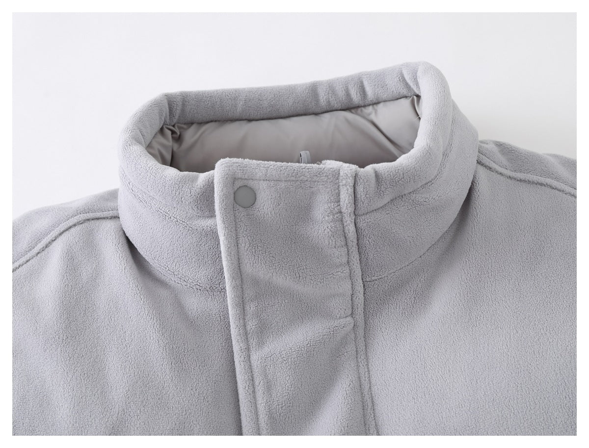 Close-up of the light gray jacket's high collar, snap tab, and contrasting smooth lining.