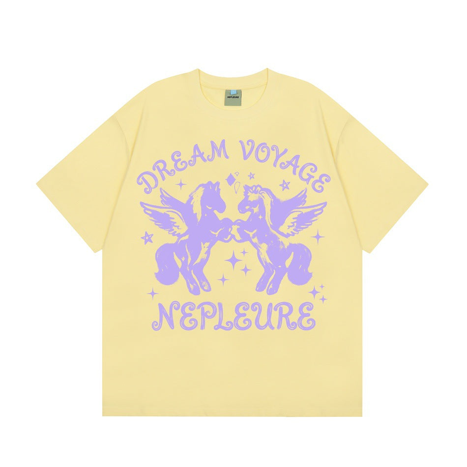 Pale yellow short-sleeve crew-neck T-shirt with lavender winged horses graphic and Dream Voyage lettering, flat front view