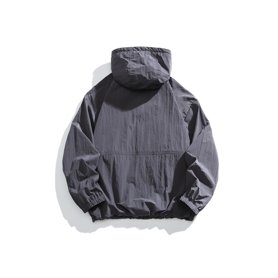 Back view of a dark charcoal-gray hooded jacket with elastic cuffs and hem, displayed against a white background.