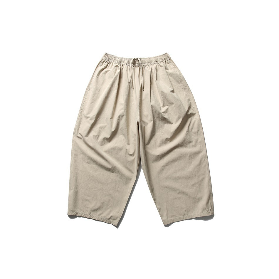 Khaki wide-leg cropped pants with elastic drawstring waist, flat lay front view