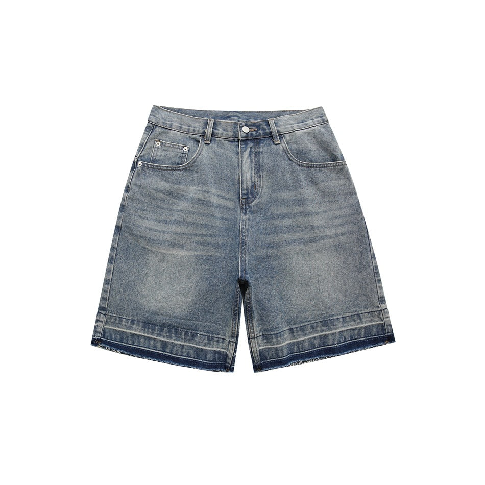 Front view of blue faded denim shorts with a raw frayed contrast hem, button zip fly and pockets