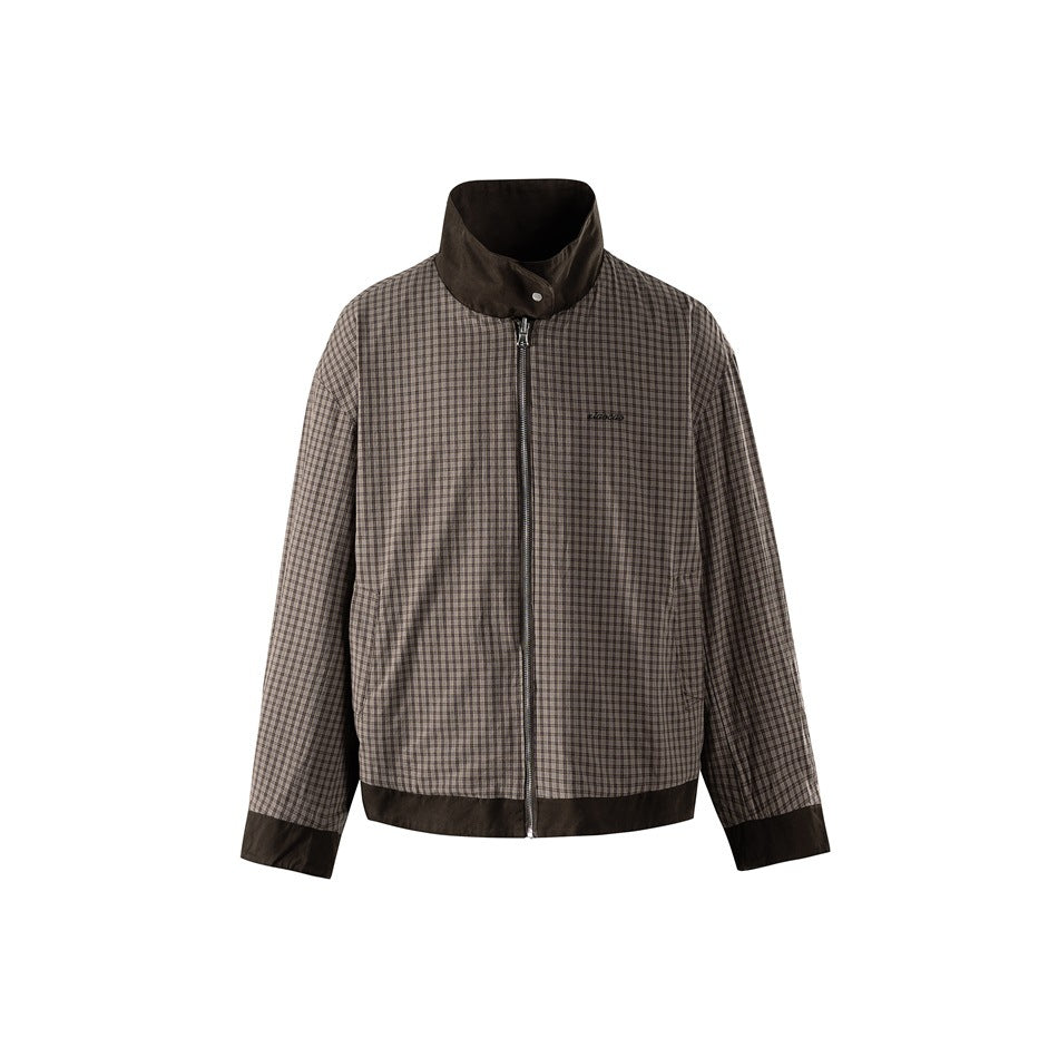 Front view of a brown-and-gray checked jacket with a dark stand collar, full zipper, and dark trim at the cuffs and hem.