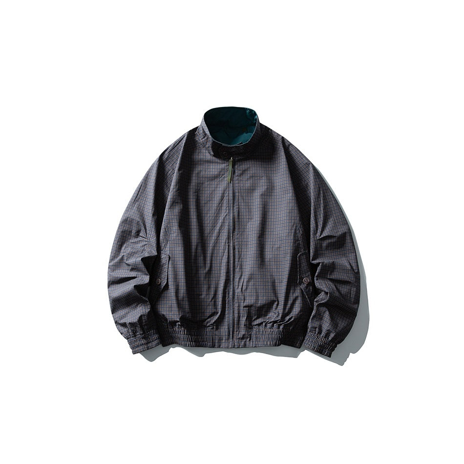 Dark gray checked stand-collar zip jacket flat lay with teal reverse visible at collar