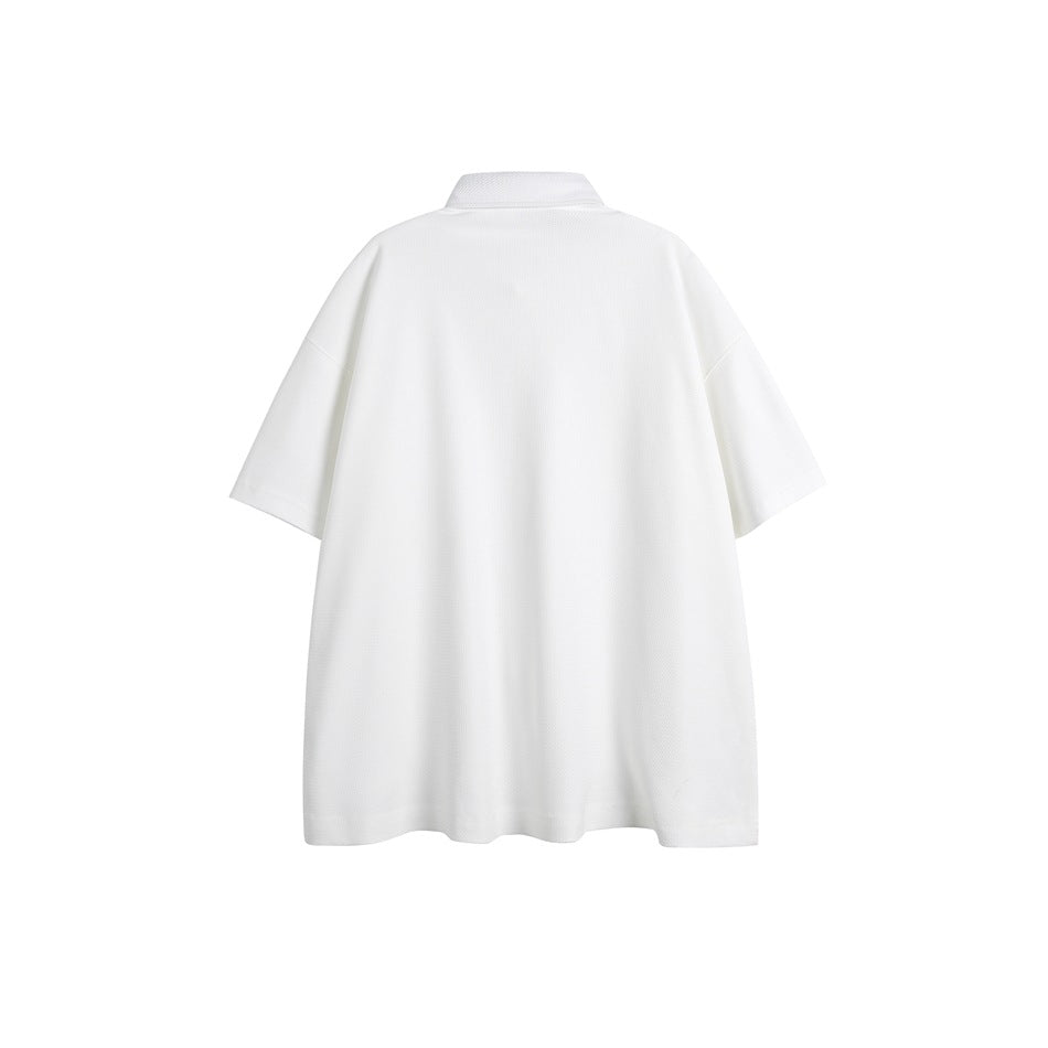 Back view of a plain white oversized short-sleeve collared shirt on a white background.