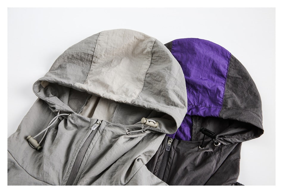 Close view of two colorways showing the jackets’ hoods, drawcords, and front zippers.