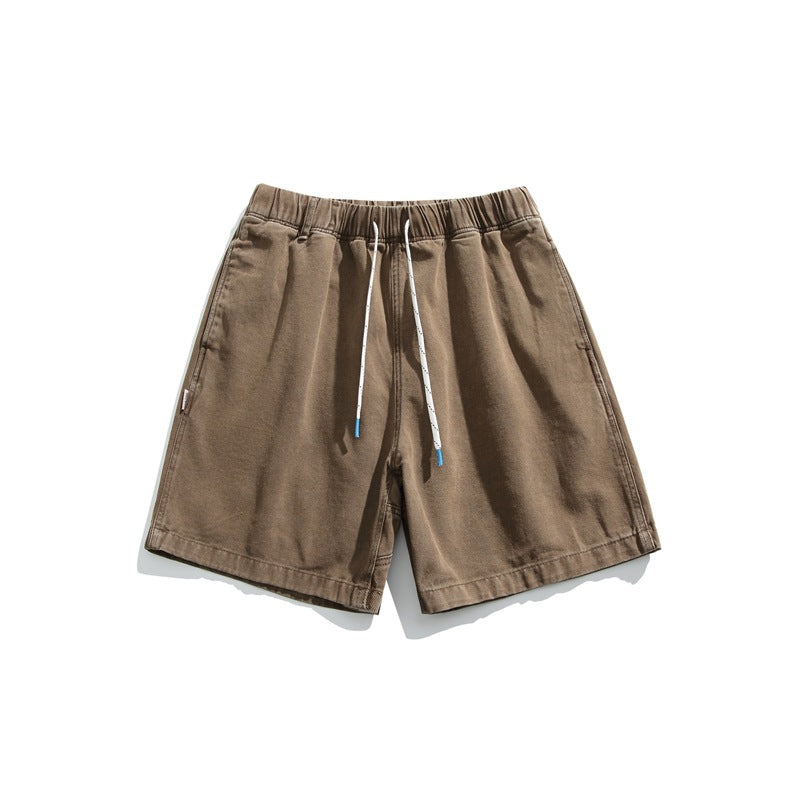 Rust brown washed shorts with drawstring elastic waist, flat lay front view