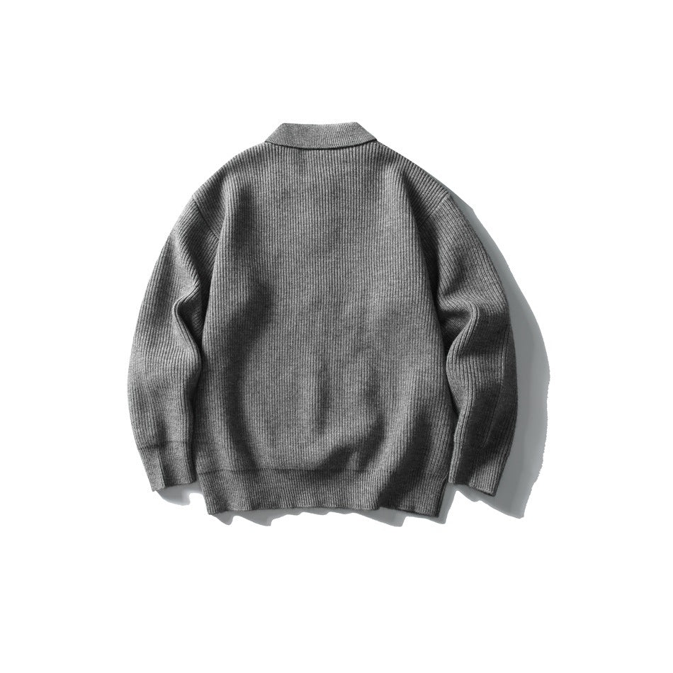 Back view of a gray long-sleeve rib-knit polo sweater laid flat.