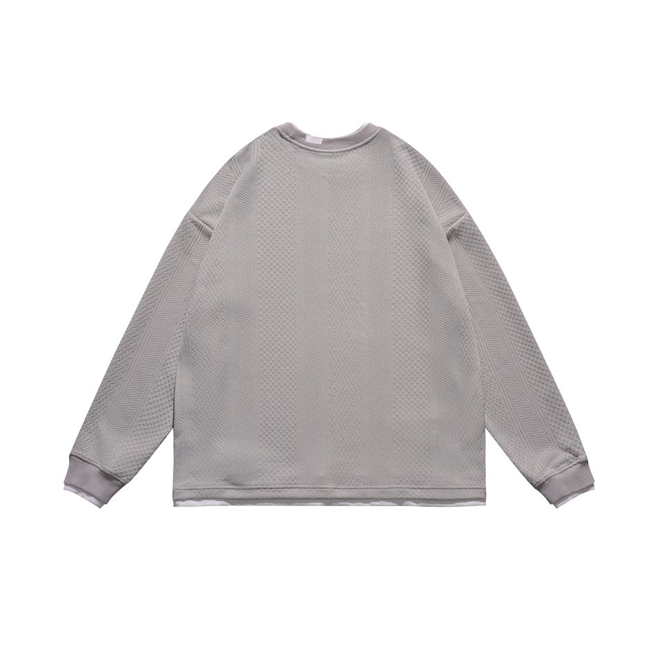 Back view of a light gray long-sleeve sweatshirt with a ribbed crew neck, cuffs and hem, and vertical textured knit panels.
