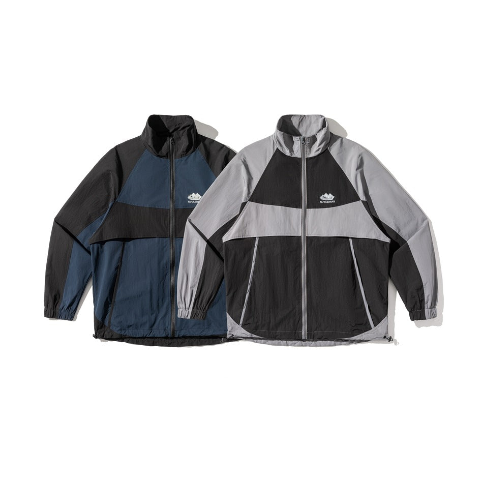Two colorways of a zip jacket shown flat: navy and black, and light gray and black.