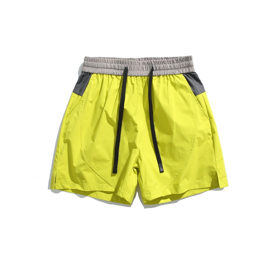 Neon green drawstring shorts with gray waistband and gray side pocket panels, flat lay front view