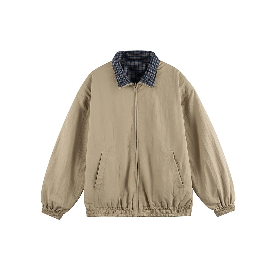 Khaki zip-up jacket flat lay with navy plaid collar lining, front pockets and elastic cuffs and hem