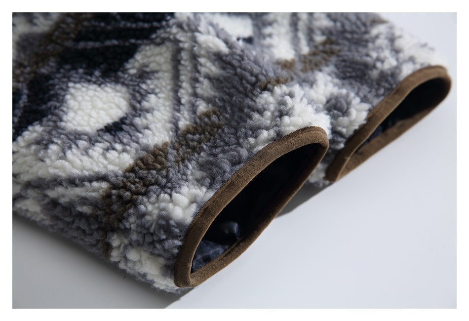 Close-up of the fleece garment's brown-bound openings and dark lining.