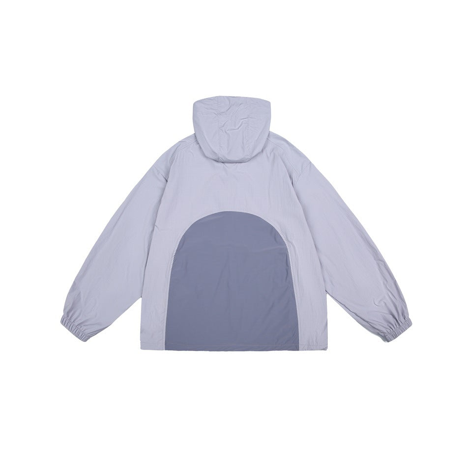 Back view of a light gray hooded jacket with elastic cuffs and a contrasting blue-gray rounded panel.
