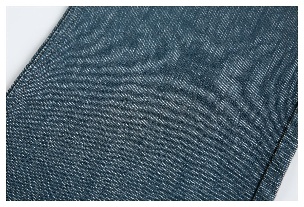 Close-up showing the fine woven texture and stitching of dark blue pants.