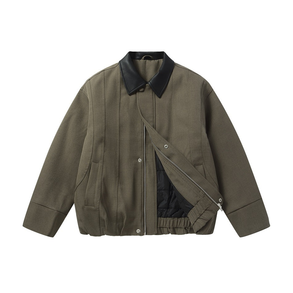 Army green collared jacket with black leather-look collar, partly unzipped to show black quilted lining
