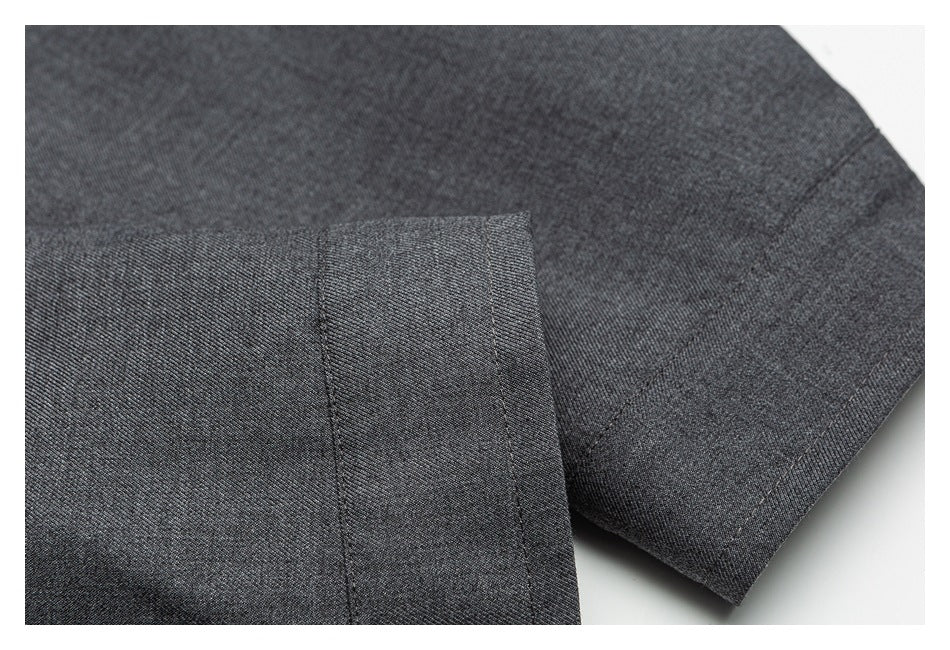 Close-up of the charcoal-gray jacket's sleeve cuff and stitched seams.