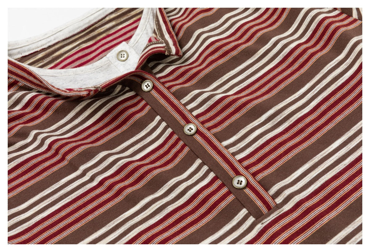 Close-up of the brown, rust, and cream striped top's neckline and button placket.