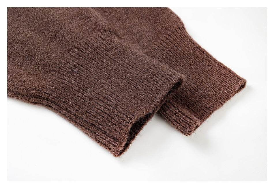 Close-up of the sweater’s dark brown knit sleeve cuffs with ribbed edges.