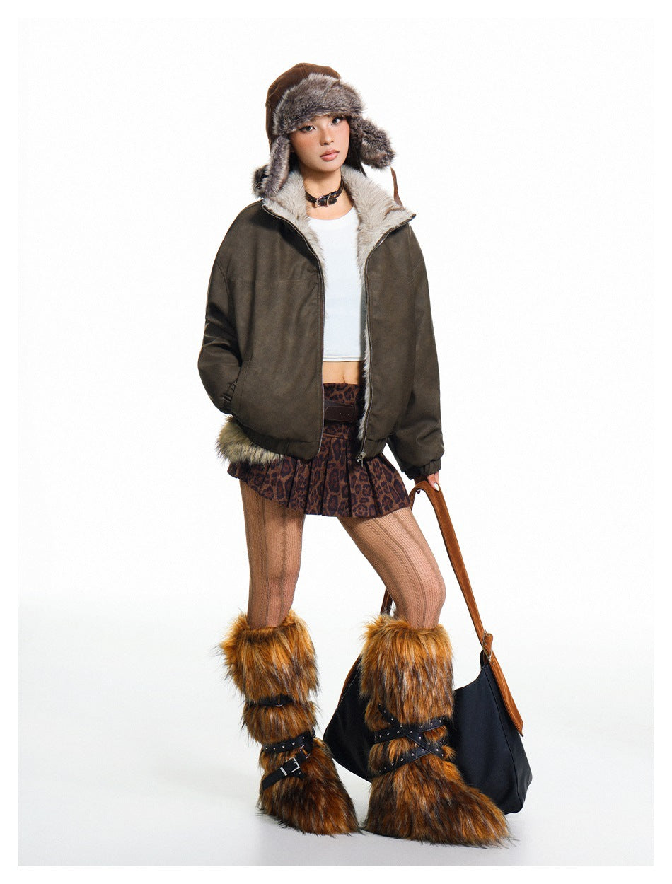 Model wearing a dark olive-brown jacket with pale plush lining and a brown fur-trimmed hat.