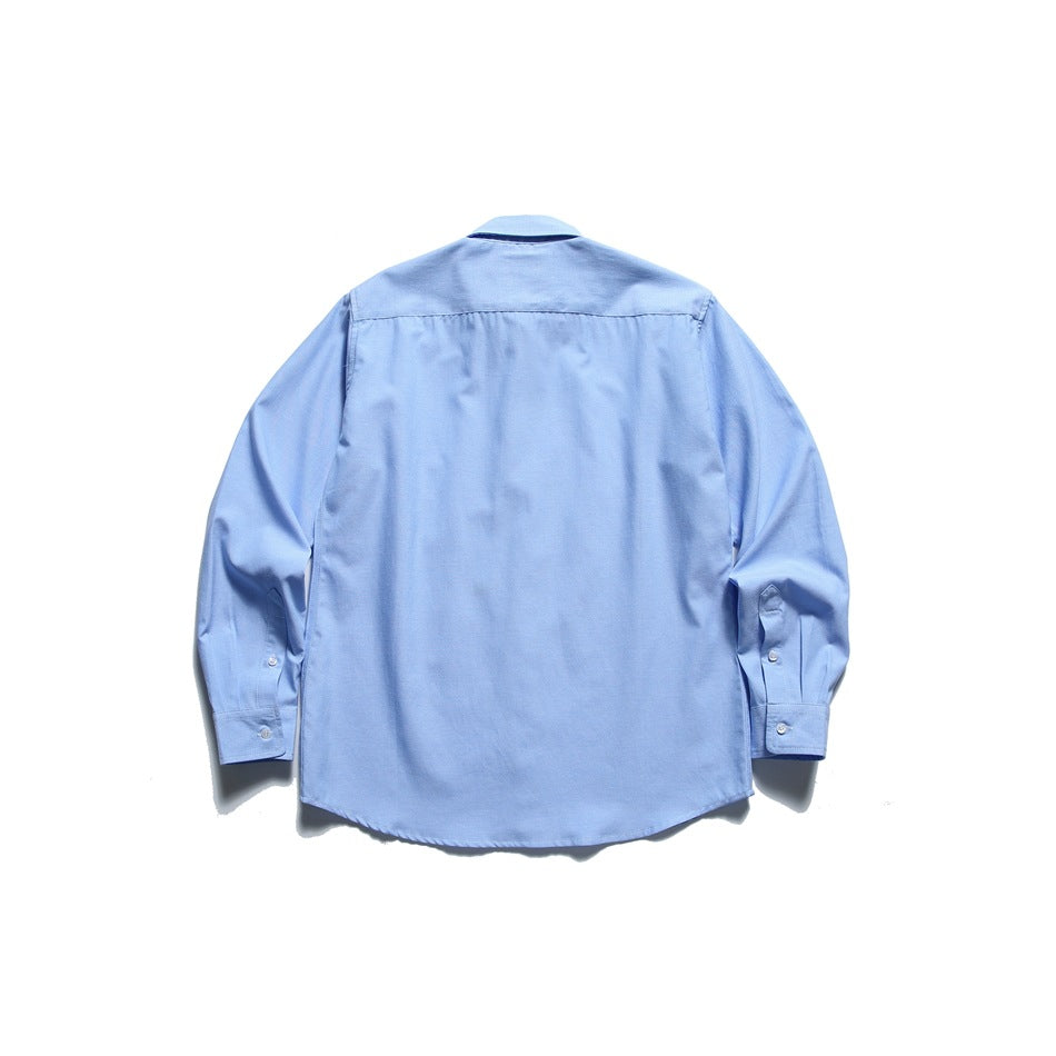 Back view of light blue long-sleeve shirt with back yoke seam and buttoned cuffs