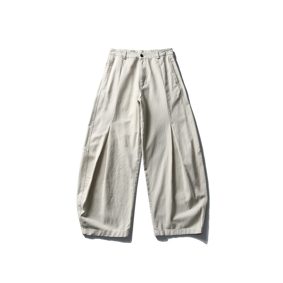 Apricot wide-leg barrel pants with front pleat seams, button closure and belt loops, flat front view